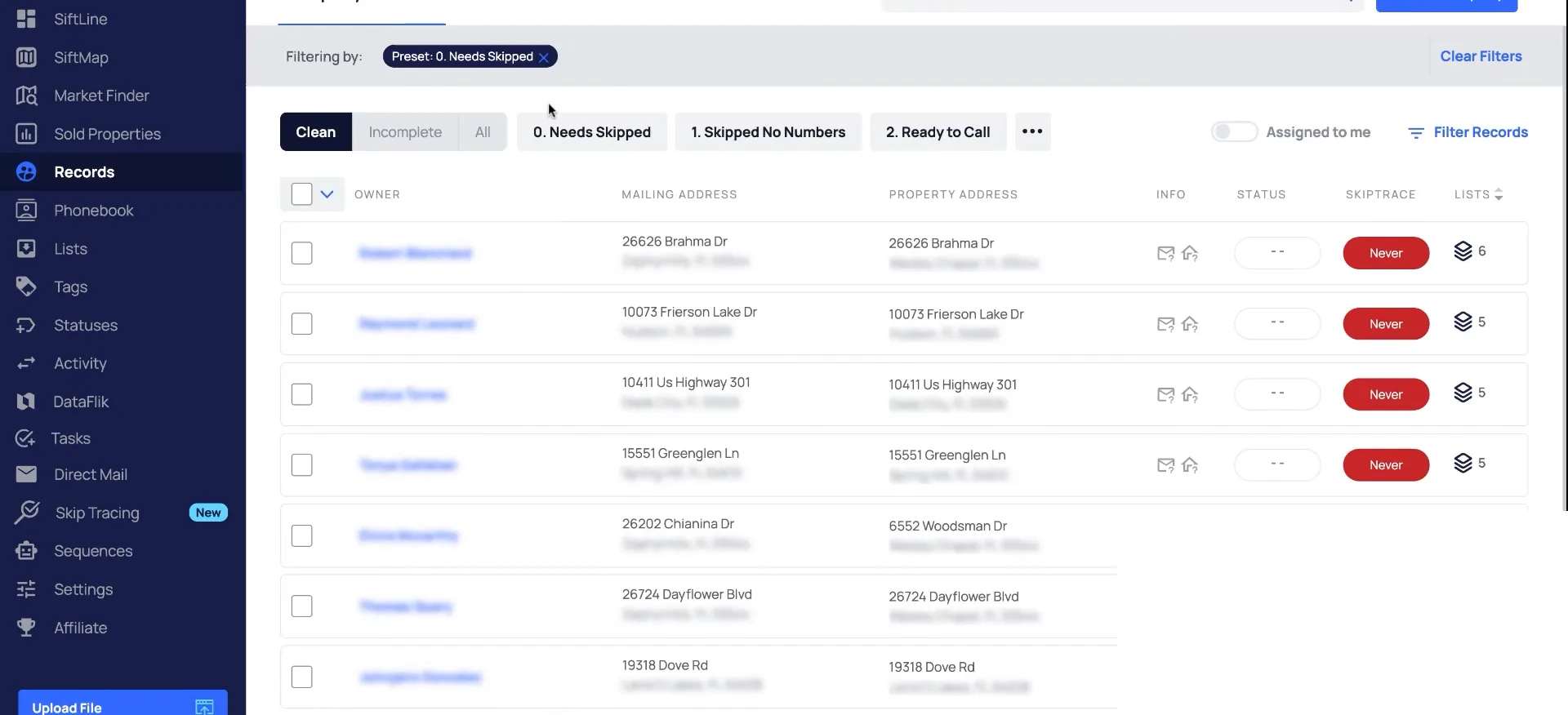 Records screen with a filtered property table, addresses, statuses, skiptrace buttons and list counts.